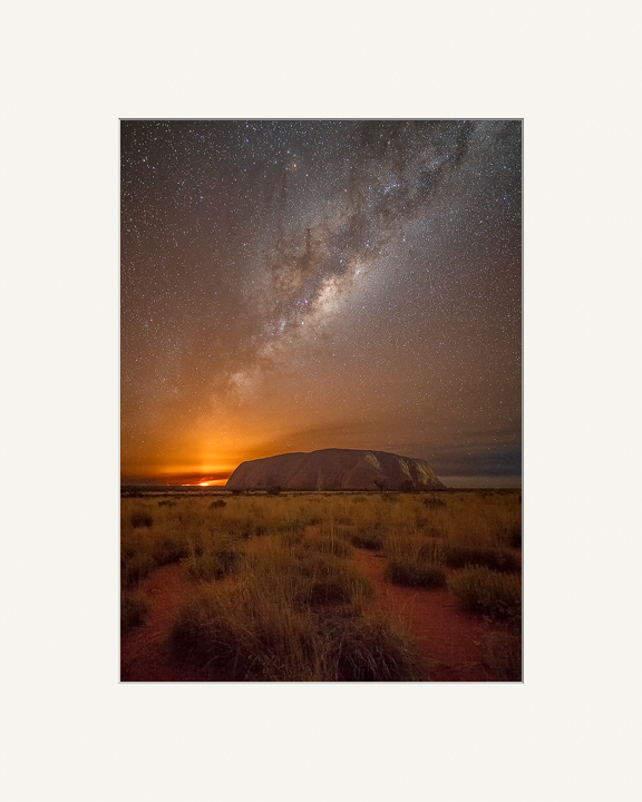 Milky Way rising over Uluru while a bushfire burns in the distance This image demonstrates the original mounted ready for framing